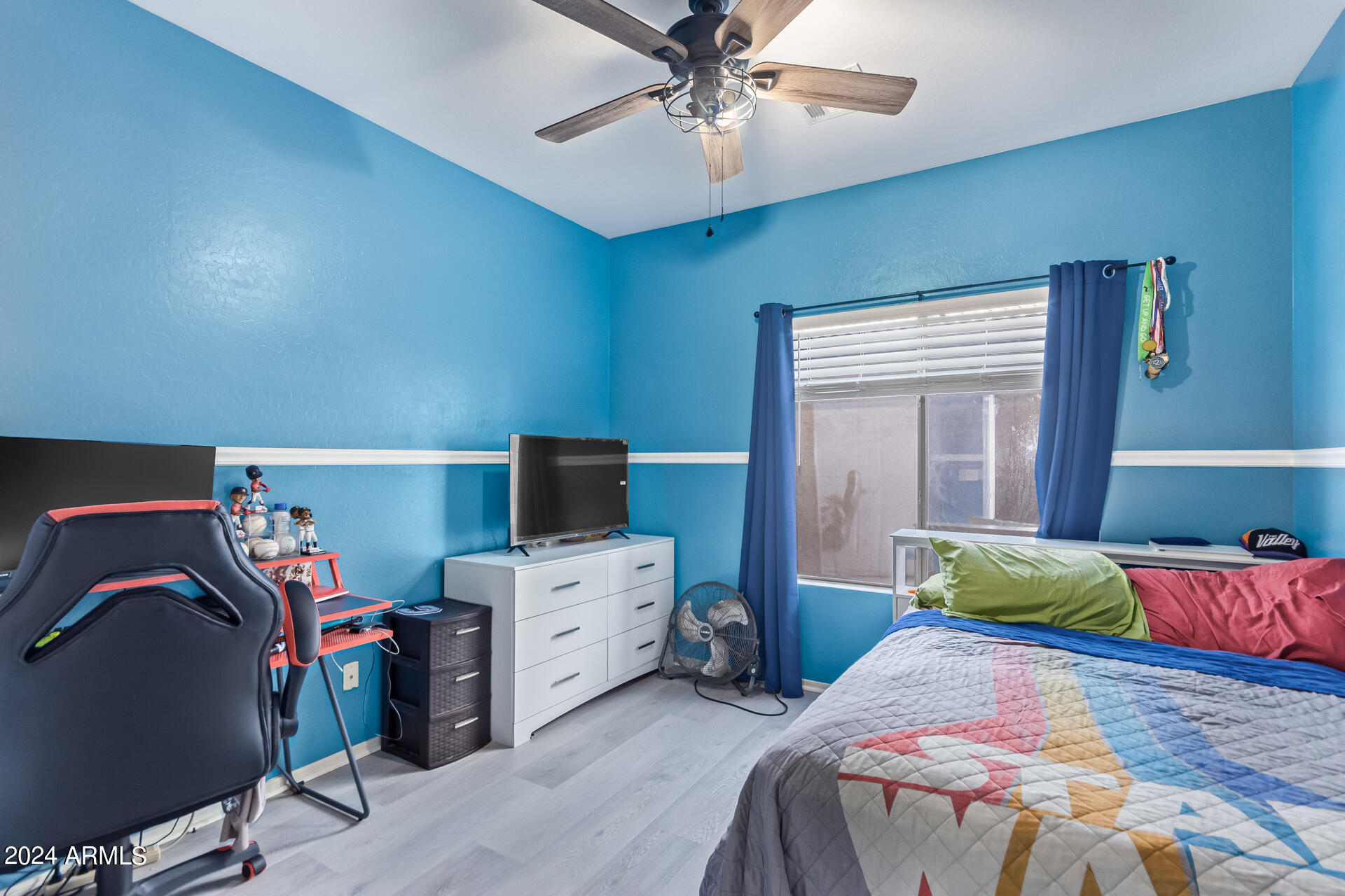321 East Cheyenne Road San Tan Valley, AZ 85143 - Photo 28 of 33 a bedroom with a bed and a tv
