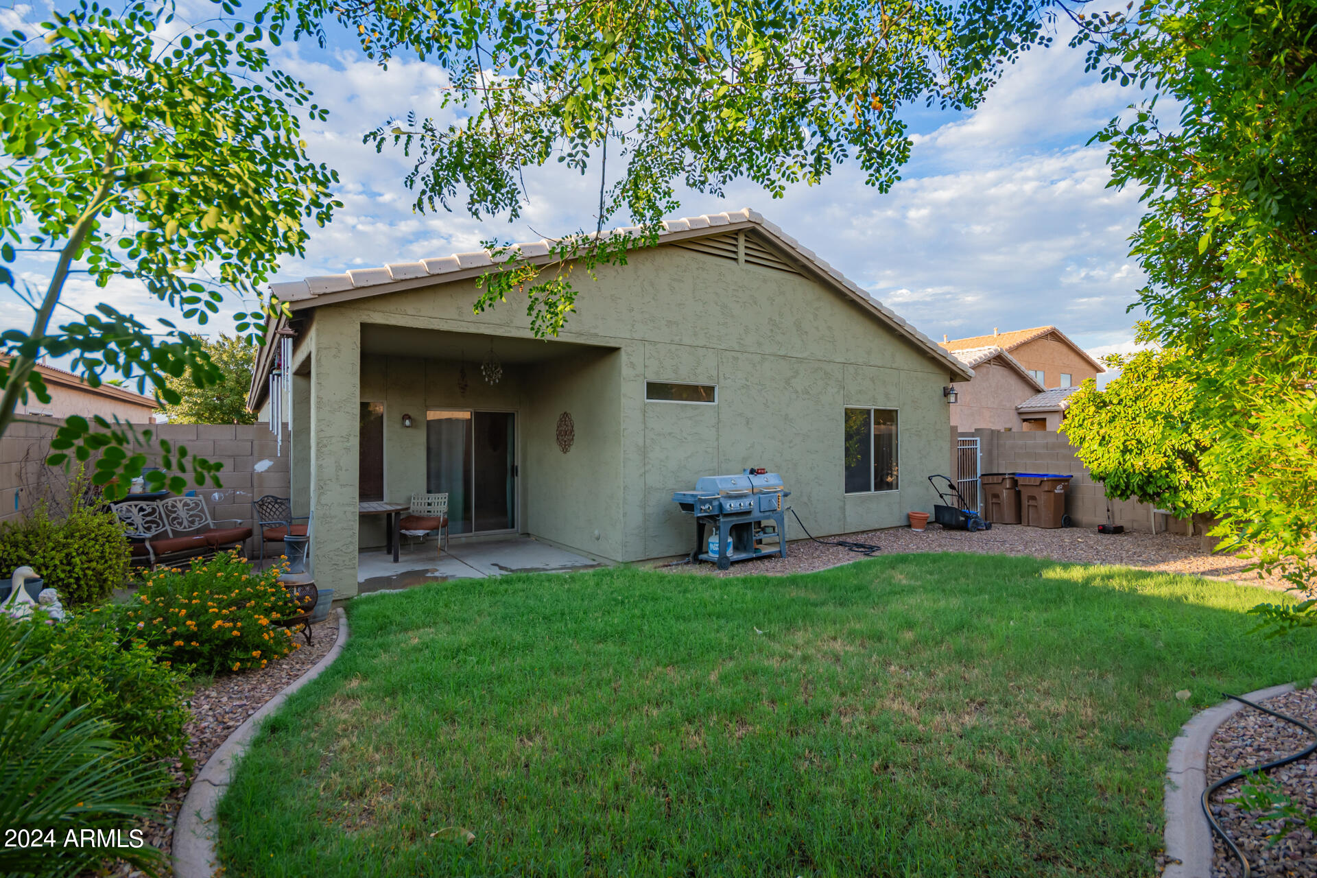 321 East Cheyenne Road San Tan Valley, AZ 85143 - Photo 32 of 33 a view of a house with a yard porch and sitting area