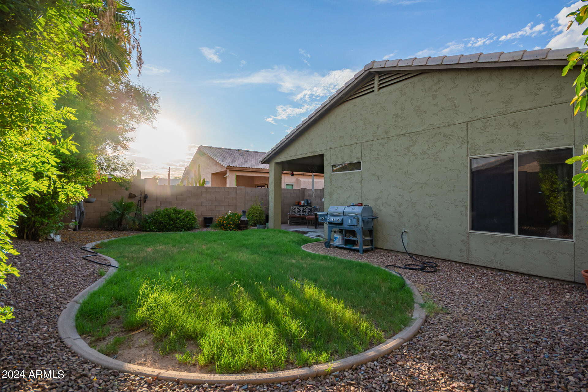 321 East Cheyenne Road San Tan Valley, AZ 85143 - Photo 33 of 33 a view of a backyard with plants and a patio