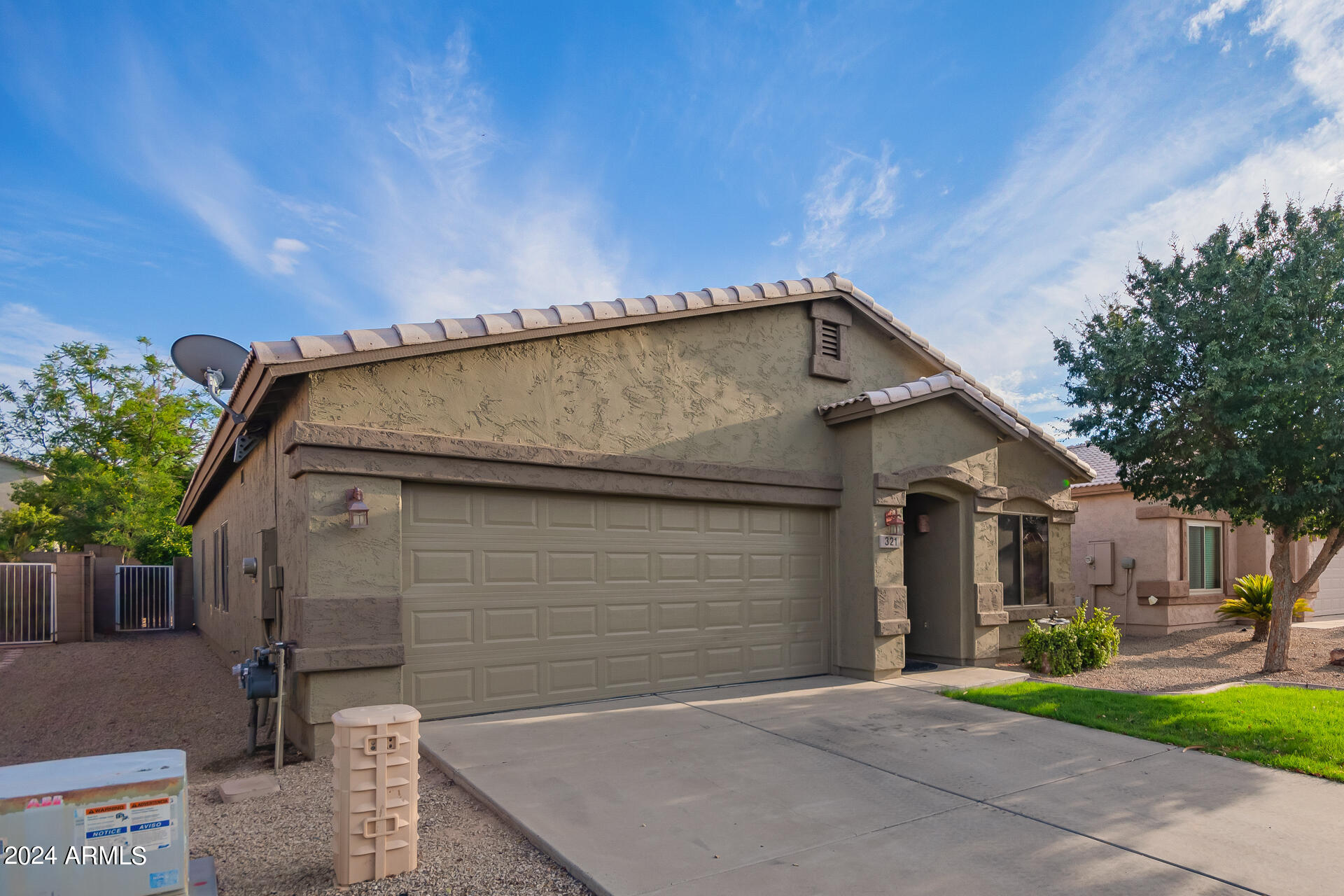 321 East Cheyenne Road San Tan Valley, AZ 85143 - Photo 4 of 33 a front view of a house with a yard