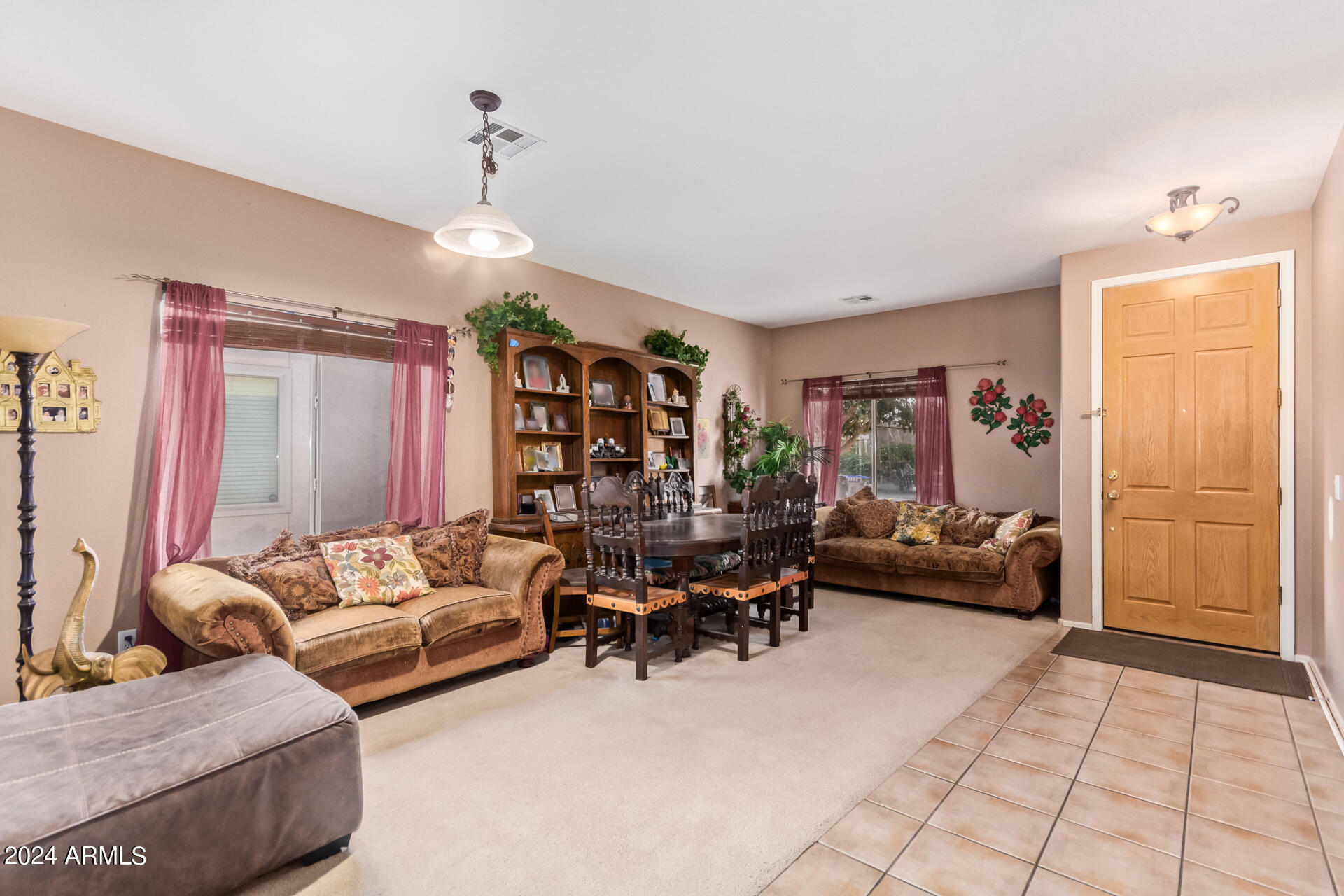 321 East Cheyenne Road San Tan Valley, AZ 85143 - Photo 7 of 33 a living room with furniture and a chandelier