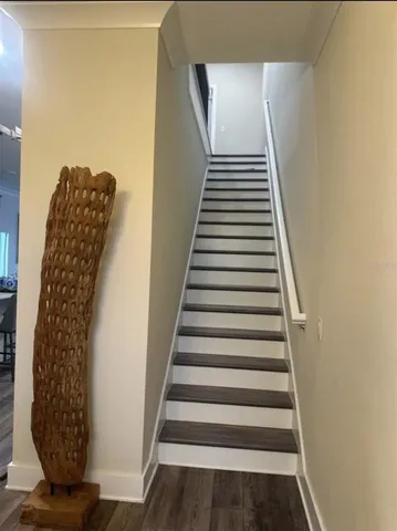 a bedroom with a bed and a television