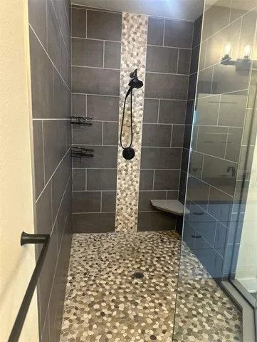 a white toilet sitting next to a white sink