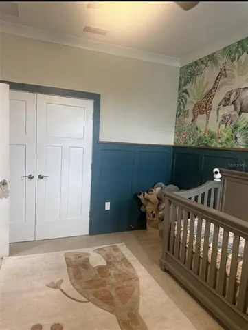 a bedroom with furniture and a window