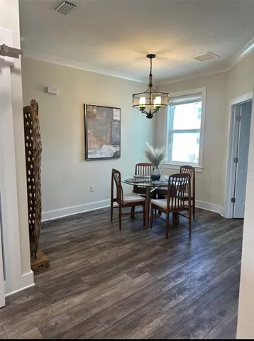 a view of a livingroom with gym equipment