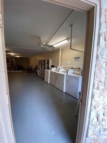 a kitchen with a refrigerator and a sink