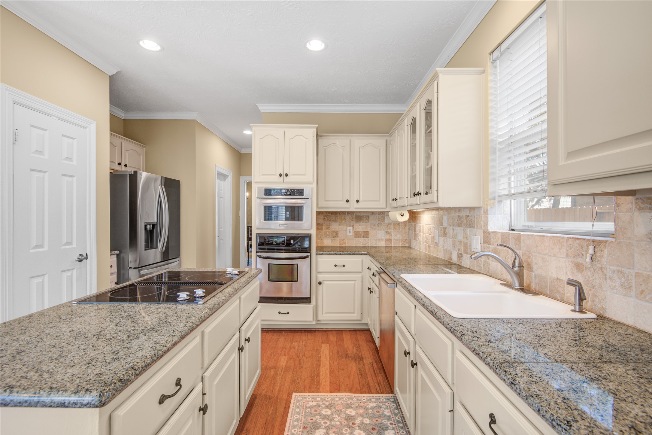 13215 Jessica Lane Houston, TX 77069 - Photo 12 of 33 Here you see the kitchen’s ample workspace and thoughtful layout designed for daily use.