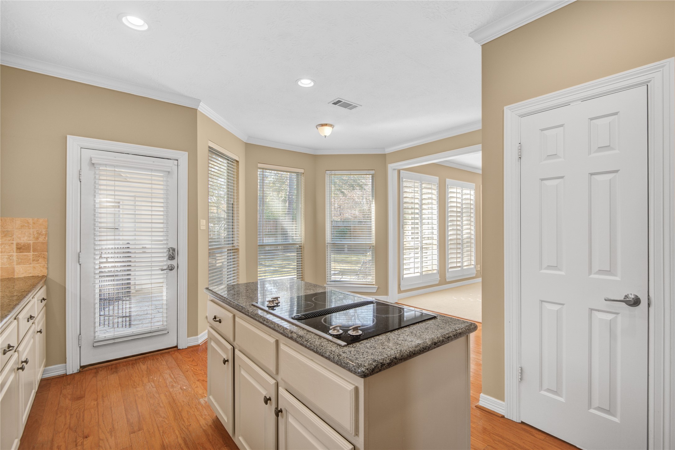 13215 Jessica Lane Houston, TX 77069 - Photo 13 of 33 The kitchen opens to a bright breakfast area, creating a comfortable space for casual meals and morning routines.