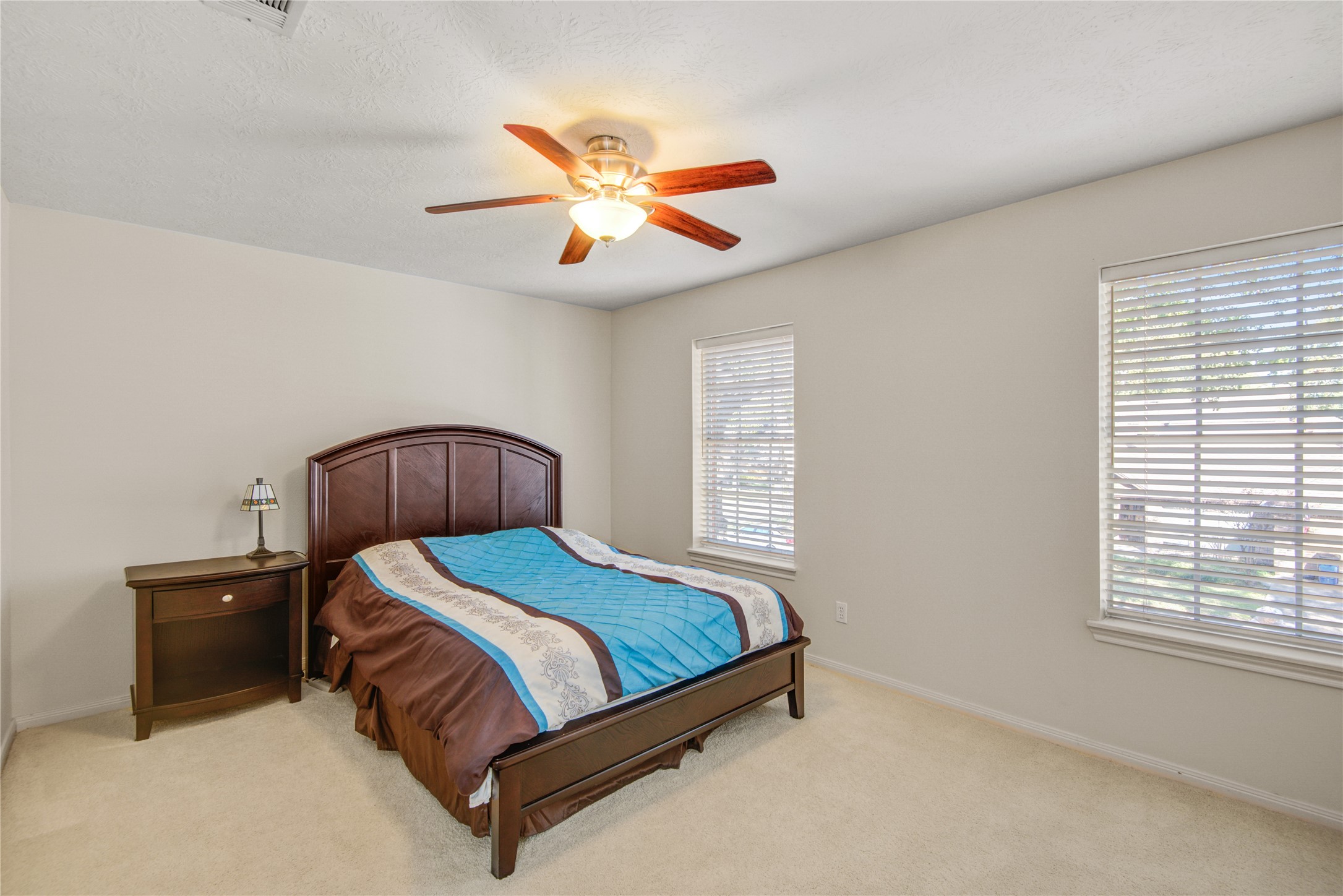 13215 Jessica Lane Houston, TX 77069 - Photo 23 of 33 An upstairs bedroom features a functional layout designed for comfort and flexibility.