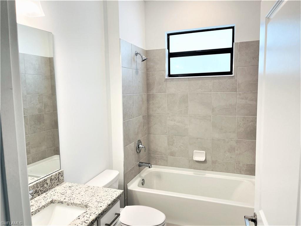 11163 Canopy Loop Fort Myers, FL 33913 - Photo 12 of 16 Bathroom with vanity and shower / tub combination