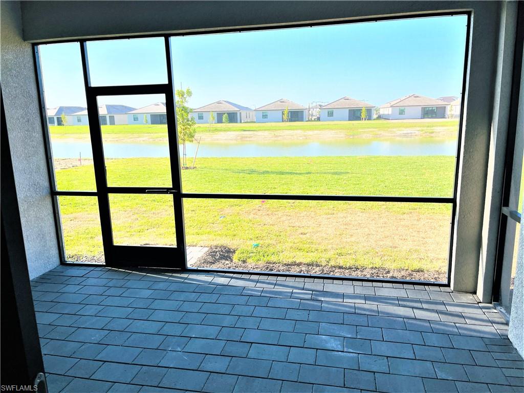 11163 Canopy Loop Fort Myers, FL 33913 - Photo 16 of 16 Unfurnished sunroom with a residential view and a water view