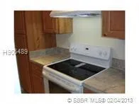 a kitchen with a sink and a stove