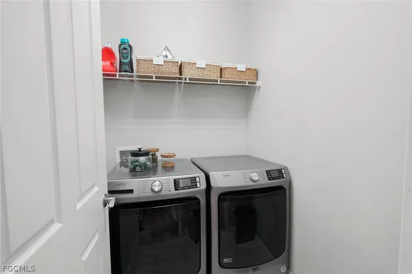 a utility room with dryer and washer