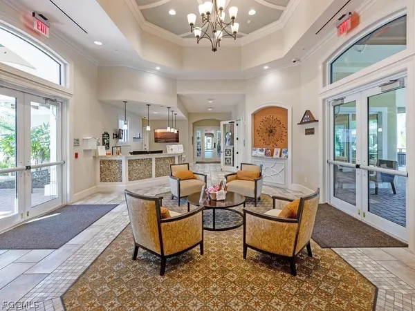 a view of a dining room with furniture wooden floor and chandelier