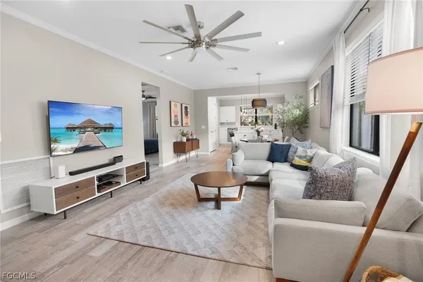 a living room with furniture and a flat screen tv