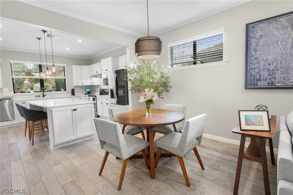 a dining room with furniture and window