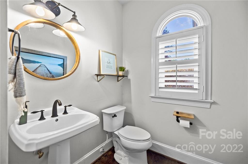 166 Lake Pointe Drive Fort Mill, SC 29708 - Photo 20 of 42 a bathroom with a sink a mirror and a toilet