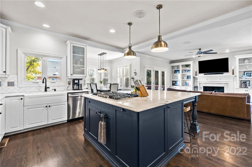166 Lake Pointe Drive Fort Mill, SC 29708 - Photo 22 of 42 a kitchen with stainless steel appliances granite countertop a sink a stove and a wooden floors