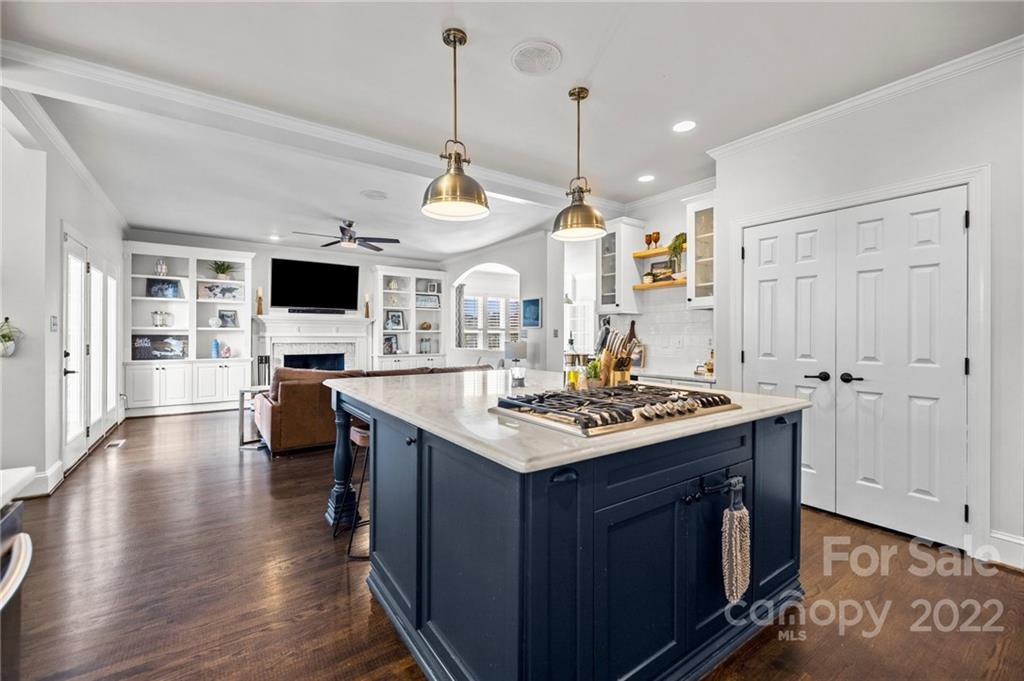 166 Lake Pointe Drive Fort Mill, SC 29708 - Photo 26 of 42 a kitchen with a sink stove and wooden floor