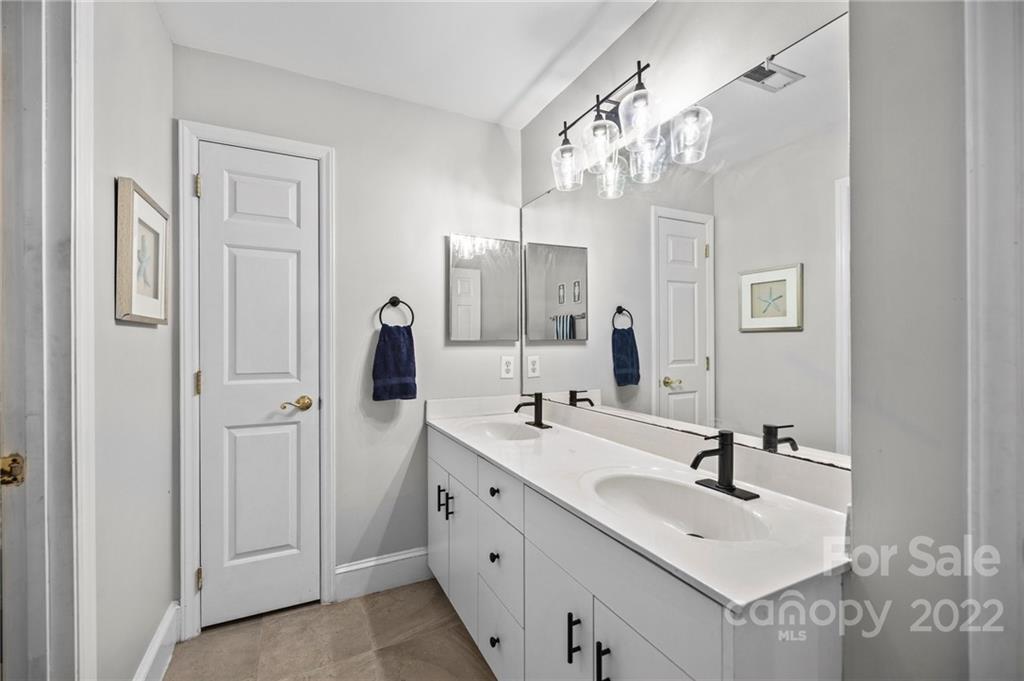 166 Lake Pointe Drive Fort Mill, SC 29708 - Photo 37 of 42 a bathroom with a sink vanity and mirror