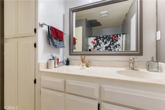 a bathroom with a sink and a mirror