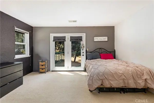 a bathroom with a sink double vanity and a mirror