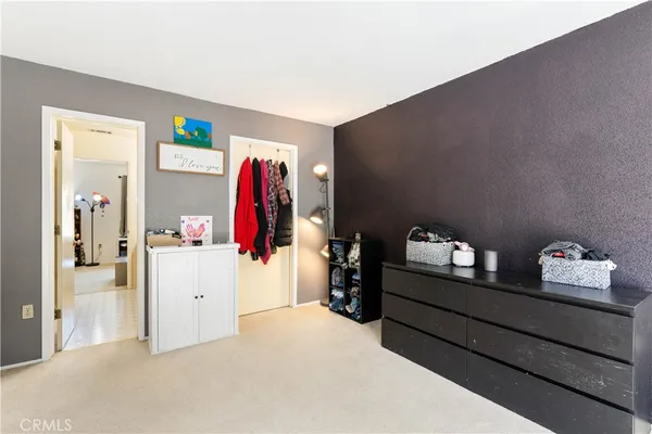 a white toilet sitting next to a shower curtain