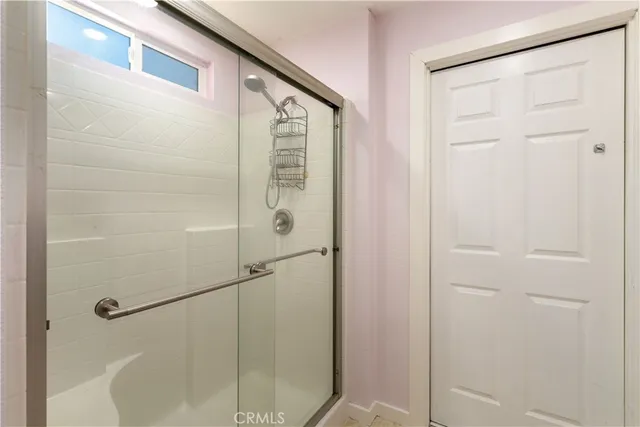 a backyard of a house with a large tree