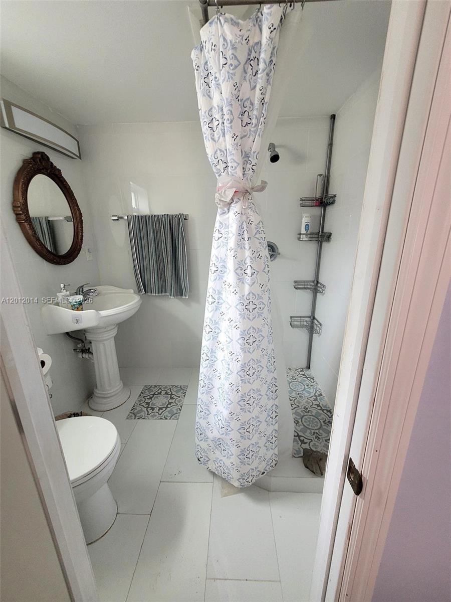 2385 Northeast 185th Street, Unit 1 Miami, FL 33180 - Photo 3 of 5 CLEAN 3/4 BATH