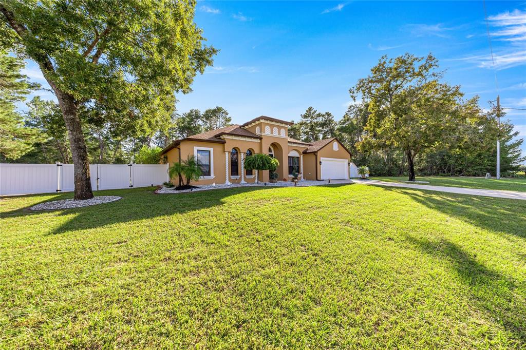 4590 Southwest 111th Place Ocala, FL 34476 - Photo 3 of 36 a view of a house with a swimming pool