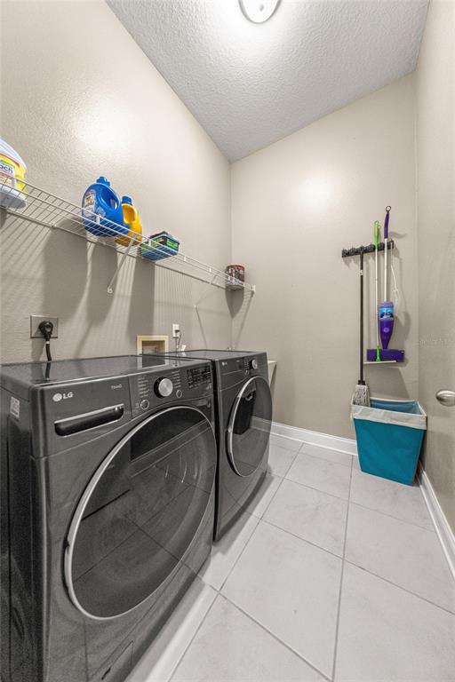 4590 Southwest 111th Place Ocala, FL 34476 - Photo 32 of 36 a utility room with dryer and washer