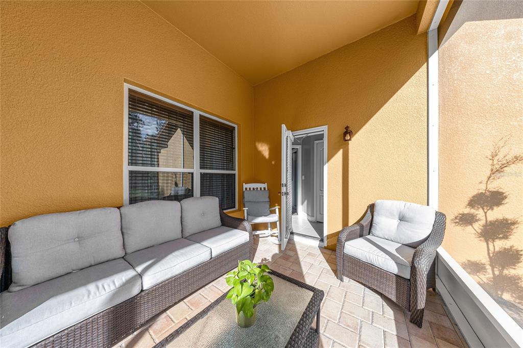 4590 Southwest 111th Place Ocala, FL 34476 - Photo 34 of 36 a living room with furniture and a large window