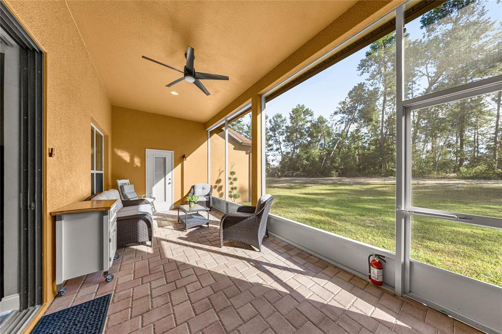 4590 Southwest 111th Place Ocala, FL 34476 - Photo 35 of 36 a view of a balcony with lake view and a floor to ceiling window