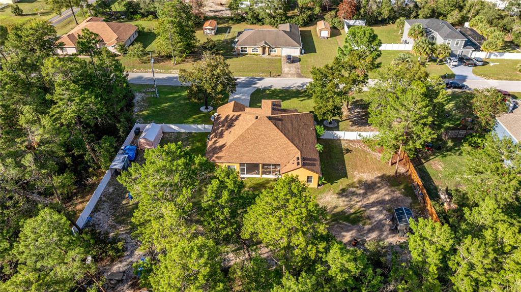 4590 Southwest 111th Place Ocala, FL 34476 - Photo 36 of 36 an aerial view of multiple houses with yard