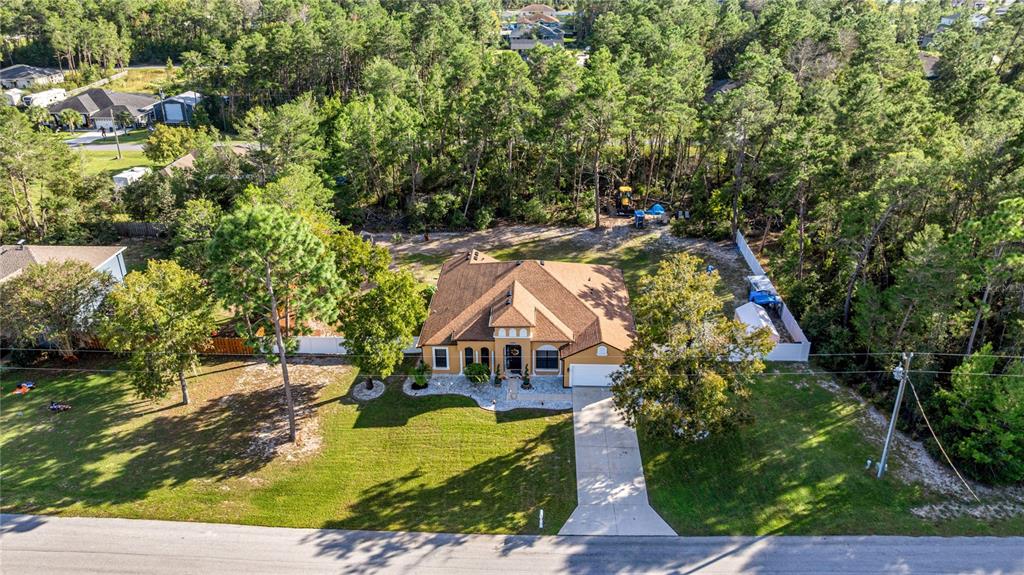 4590 Southwest 111th Place Ocala, FL 34476 - Photo 8 of 36 a view of house with yard and swimming pool