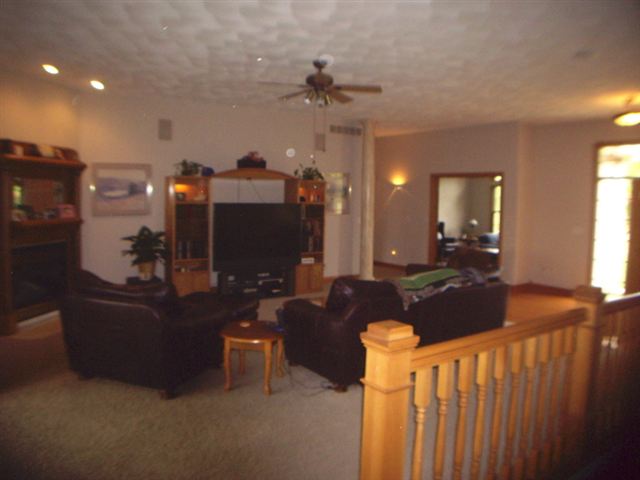 3085 West Forest Road Freeport, IL 61032 - Photo 3 of 9 a living room with furniture and a chandelier