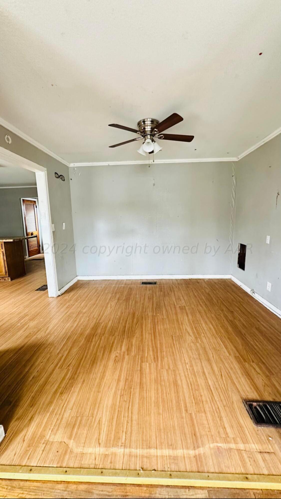 4101 South Jackson Street Amarillo, TX 79110 - Photo 3 of 13 a view of a room with wooden floor