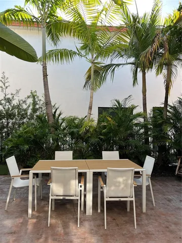 a view of an outdoor space with furniture