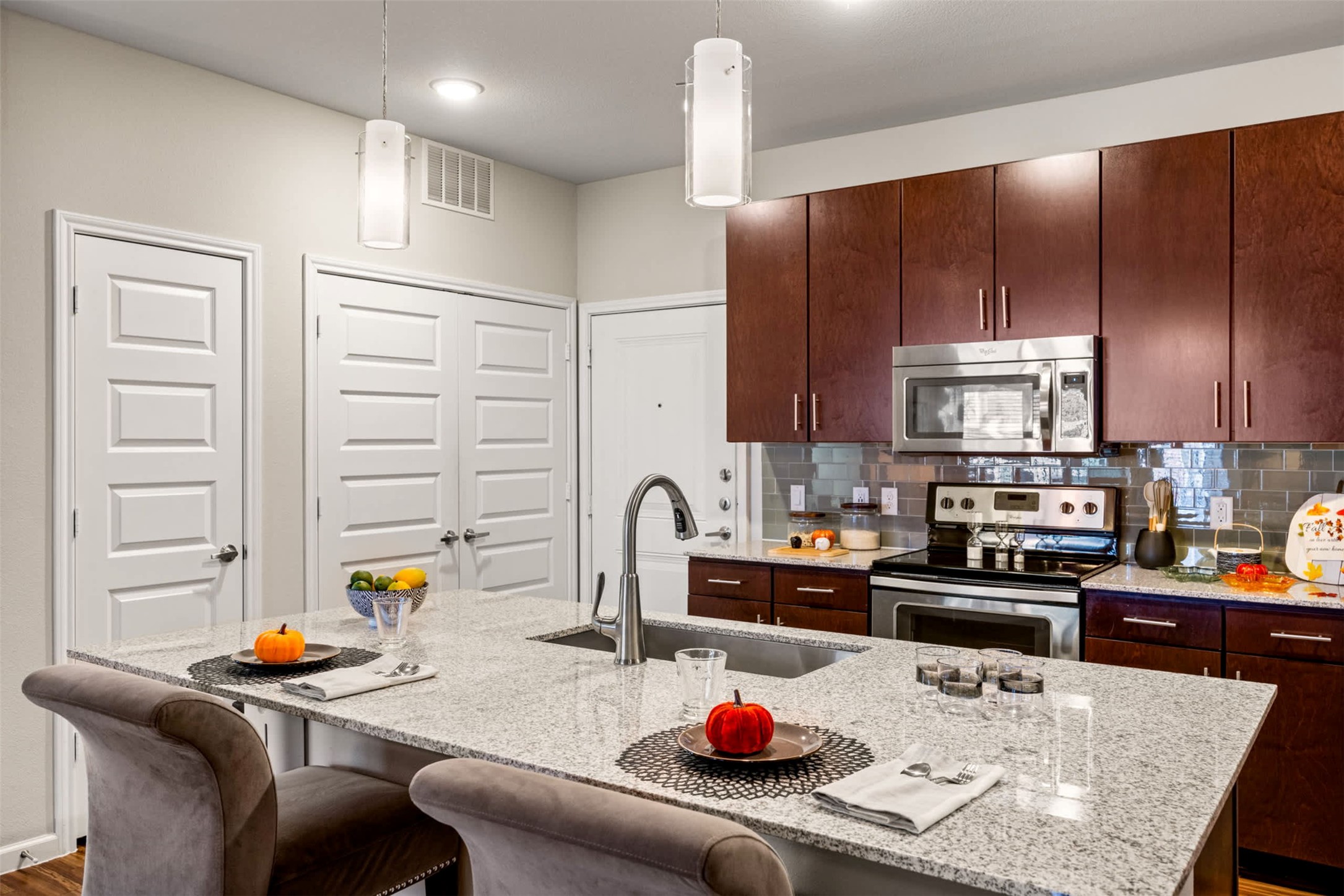 9308 South 1st Beach, Unit 231 Austin, TX 78748 - Photo 11 of 23 a kitchen with a sink a stove and chairs