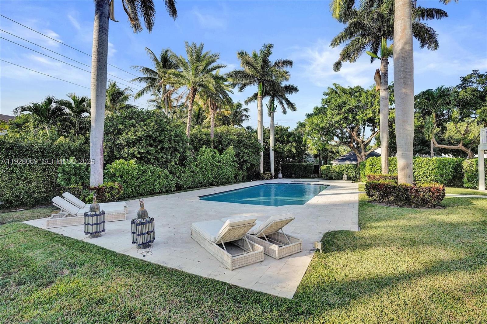 1281 Banyan Road Boca Raton, FL 33432 - Photo 12 of 69 a view of a swimming pool with a patio