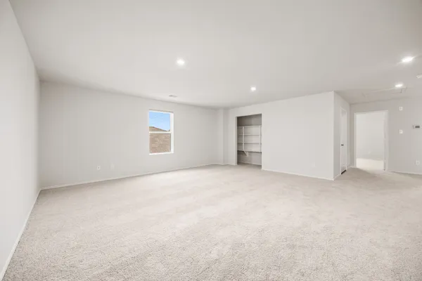 a view of an empty room with a window