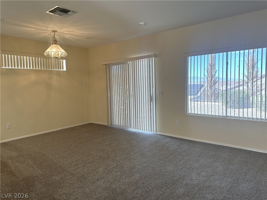 3034 Canal Walk Road Henderson, NV 89052 - Photo 15 of 24 Bright, spacious room featuring soft carpeting and abundant natural light.