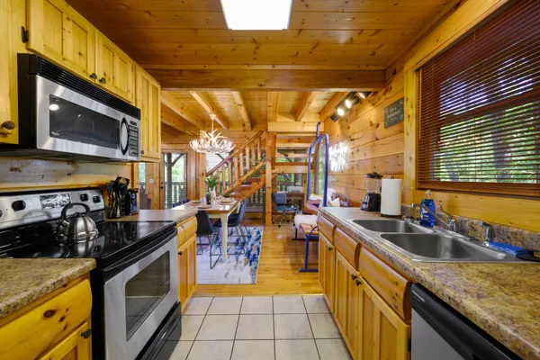 a view of a living room and kitchen