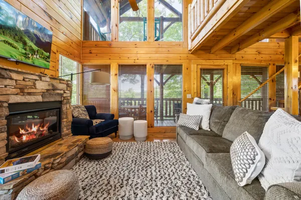 a outdoor living space with patio furniture and a fireplace