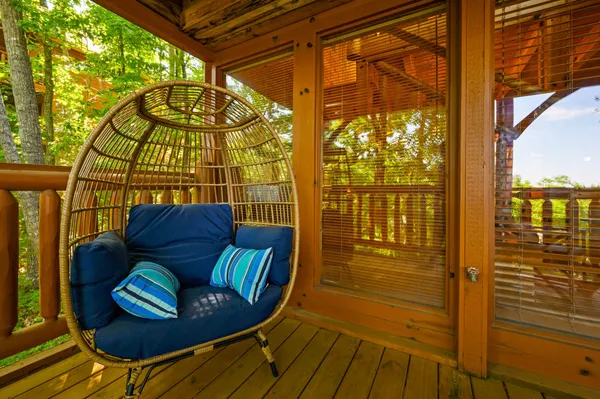 a view of two chairs in the balcony