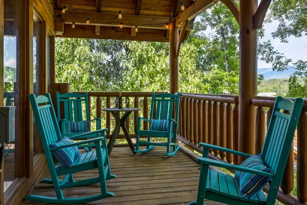 a spacious bedroom with a bed and wooden floor
