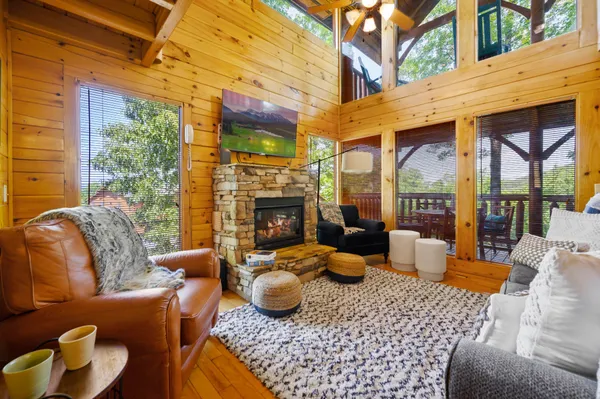 a outdoor living space with furniture potted plant and a large window