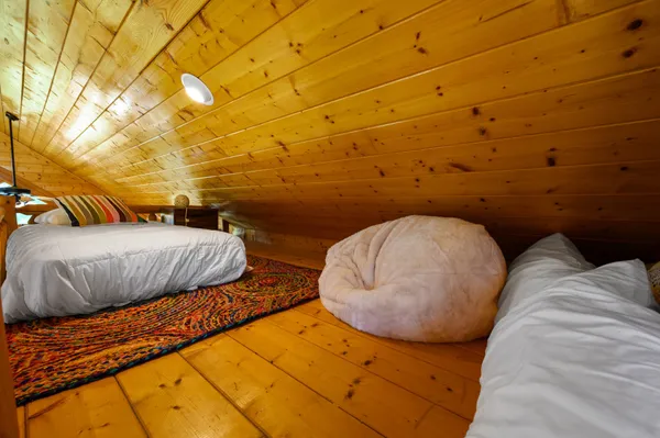 a view of a livingroom with wooden floor and outdoor space