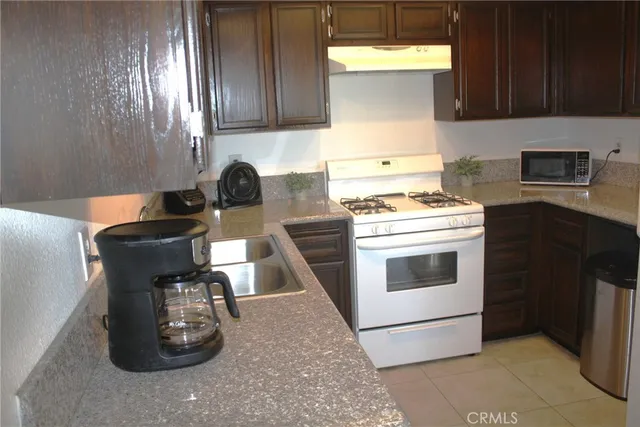 a kitchen with a stove and a refrigerator