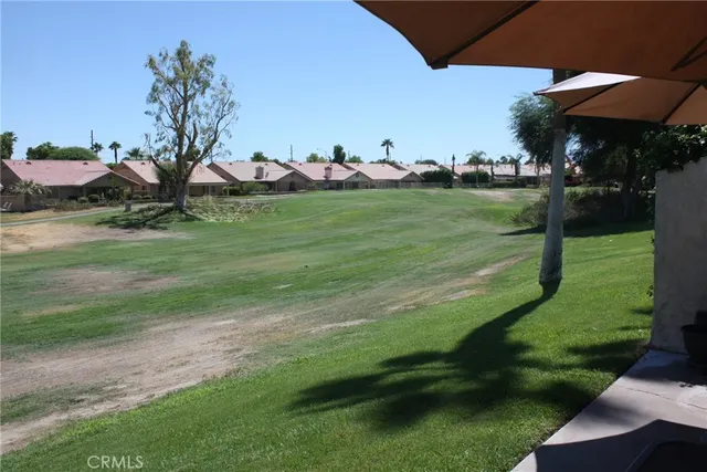 a view of a golf course with a garden